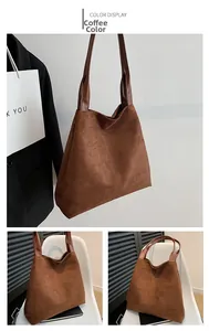Detail of coffee brown suede tote bag featuring smooth leather handles and large capacity