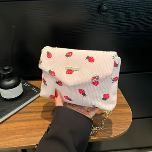 Cute strawberry print corduroy crossbody bag with golden chain and metal detail