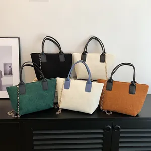 Minimalist corduroy tote bags in multiple colors with sleek metal chain straps