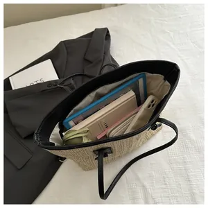 Top view of spacious straw tote bag showing interior capacity for iPad and daily essentials