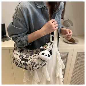 Canvas crescent tote bag with vintage forest print and cute panda charm detail