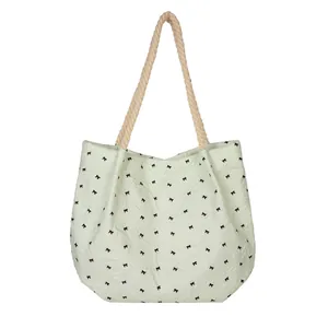 Sac fourre-tout plissé vert menthe avec motifs de nœuds noirs et anses en corde