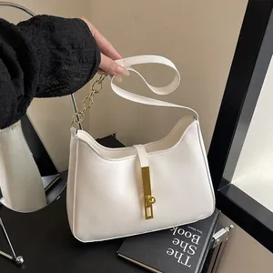 Chic white half-moon shoulder bag with gold chain and sleek metal buckle detail