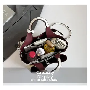 Top view of white leather tote bag interior showing large capacity and inner pockets