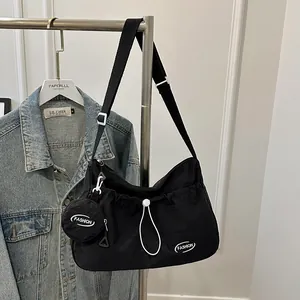 Large black nylon tote bag with white FASHION print and removable round pouch