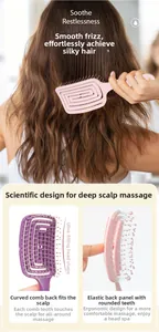 Close-up of curved vented hair brush with flexible back for scalp massage and detangling
