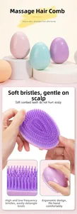 Macro shot of egg-shaped detangling hairbrush with multi-level flexible massage bristles