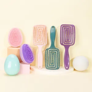 Pastel set of egg-shaped detangling brushes and hollow spiral combs for hair styling