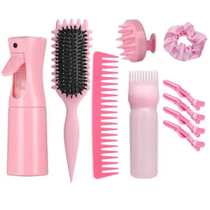 Pink hair care styling kit with spray bottle, combs, scalp massager and clips
