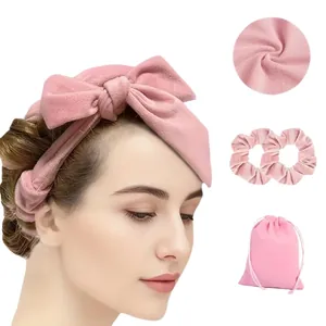 Pink heatless hair curler set with a bow headband, hair scrunchies and drawstring storage bag