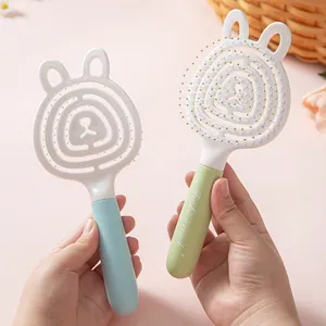 Brosse à cheveux évidée en forme d'ours pour massage du cuir chevelu en bleu et vert