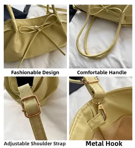 Detail view of yellow handbag showing bow design, handles, strap and metal hook