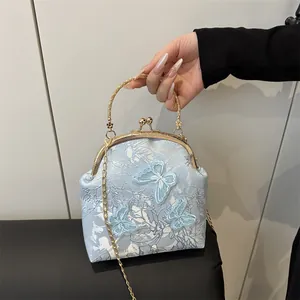 Retro light blue floral tote bag with butterfly embroidery and golden metal clasp