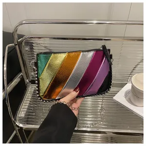 Detail of rainbow crossbody bag with pebbled leather stripes and metallic bead trim