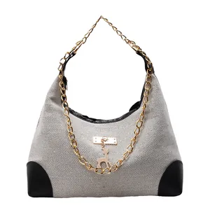 Minimalist large-capacity tote bag with woven canvas, black faux leather trim and gold chain