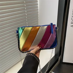 Rainbow striped crossbody bag with metallic finish and silver rivet trim chain strap