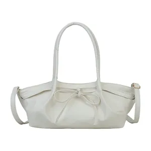Woven cream white handbag for women with bow detail and adjustable shoulder strap