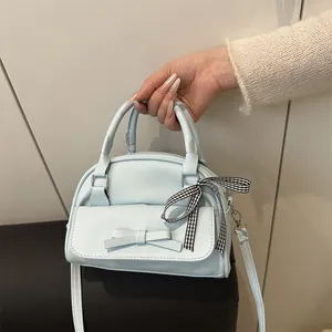 Elegant light blue bow handbag with checkered ribbon strap and top handles for women