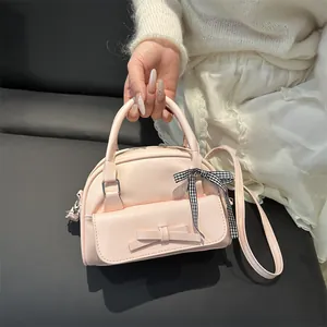 Pink bow handbag with semi-circle design and gingham ribbon accent for women