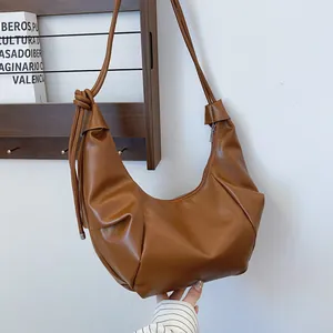 Brown PU leather minimalist crescent hobo bag with stylish knotted shoulder strap detail