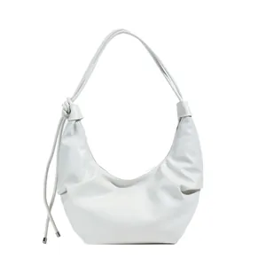 White crescent PU leather shoulder bag with pleated texture and knot strap detail