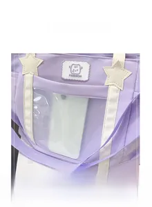Detail of lavender tote bag featuring a transparent front window and star patch