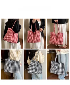 Close-up of a checkered tote bag with a decorative bow knot on the shoulder strap