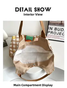 Detail show of canvas tote bag interior with magnetic buckle and brown plaid pattern