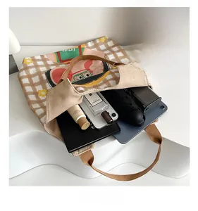 Top view of spacious canvas tote interior showing storage capacity for daily essentials