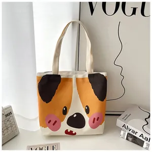 Close-up of cream canvas tote bag with cute cartoon dog print in a stylish setting