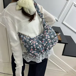 Floral crescent shoulder bag with bow detail in navy blue canvas for casual daily wear