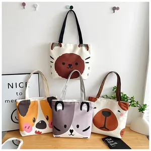 Detail shot of canvas tote bags with cute animal prints in a minimalist home setting