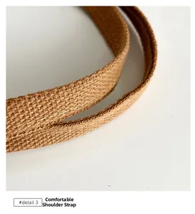 Detail view of the durable woven canvas shoulder strap with reinforced stitching