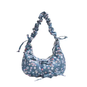 Blue floral hobo bag with pleated cloud handle and bow detail for 2025 spring collection