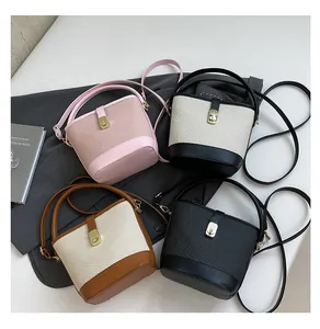 Flat lay showing multi-color bucket bags with woven texture and leather handles