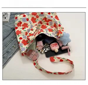 Interior view showing the large capacity of the floral canvas tote bag for daily essentials
