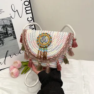 Borsa a tracolla bohémien tessuta a mano con motivi ondulati colorati e lunghe frange