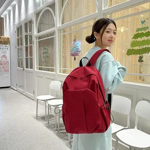 Sac à dos rouge minimaliste à grande capacité pour ordinateur avec poches latérales