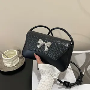 Classic black shoulder bag with crocodile texture cover and silver butterfly buckle detail