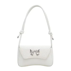 White shoulder bag with woven flap and silver bow buckle for women's spring fashion