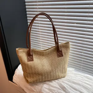 Retro woven contrast bucket bag with brown leather handles for beach vacation style