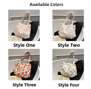 Detail view showing four floral canvas tote bags with rose, butterfly and flower patterns