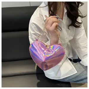 Detailed macro view of heart-shaped laser crossbody bag with metallic rainbow gradient finish