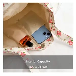 Detail view of large floral canvas tote interior with magnetic closure and inner pocket
