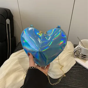 Iridescent blue heart-shaped crossbody bag with laser finish and golden chain strap