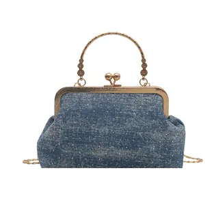 Retro denim blue shell crossbody bag with silver polka dots and gold metal frame