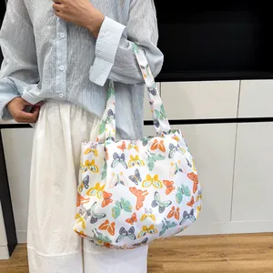 Floral canvas tote bag with colorful butterfly print and large capacity for daily use