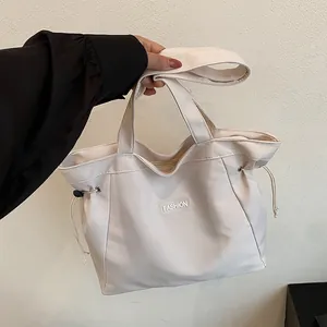 Sac Fourre-tout en Toile Mode Femme Grande Capacité Cordon de Serrage Sac à Bandoulière Minimaliste Urbain Patch Lettre Sac à Main École