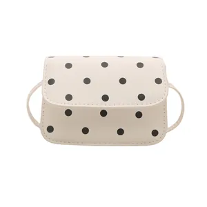 Chic cream white crossbody square bag with black polka dot pattern and sleek PU leather finish