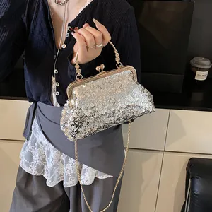 Elegant silver sequin clutch bag with vintage metal handle and crossbody chain strap
